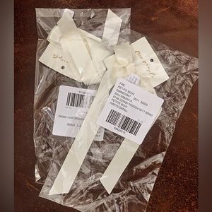 Petite free people bow in ivory.